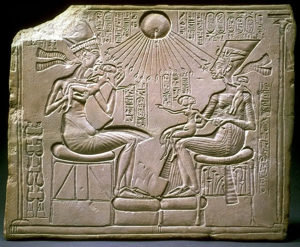 Relief depicting Akhenaton and Nefertiti with three of their daughters under the rays of Aton